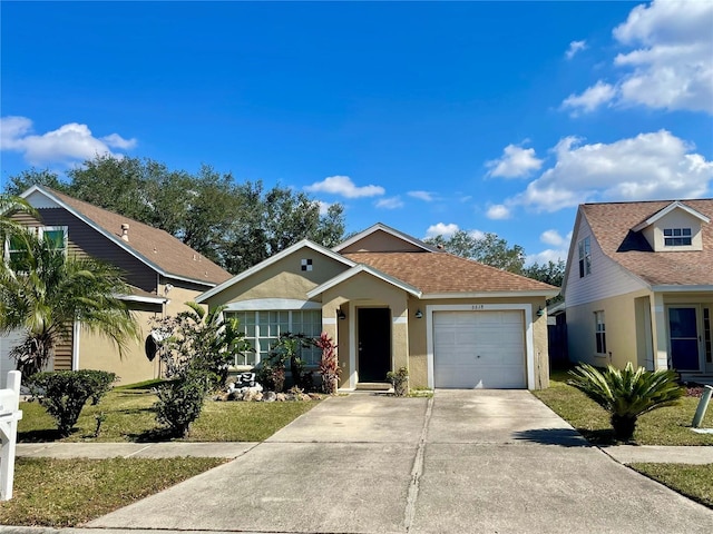 view of front facade with a garage and a front lawn