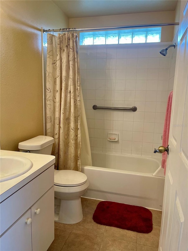 full bathroom with a healthy amount of sunlight, vanity, shower / bath combo, and tile patterned floors