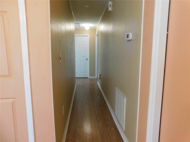 hall with dark hardwood / wood-style floors