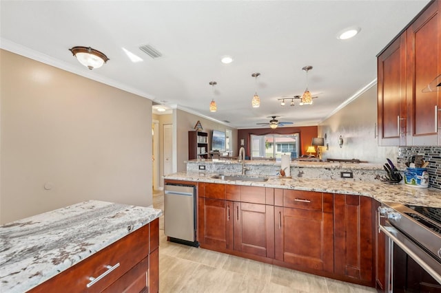 kitchen featuring sink, ornamental molding, high end stainless steel range oven, ceiling fan, and light stone countertops