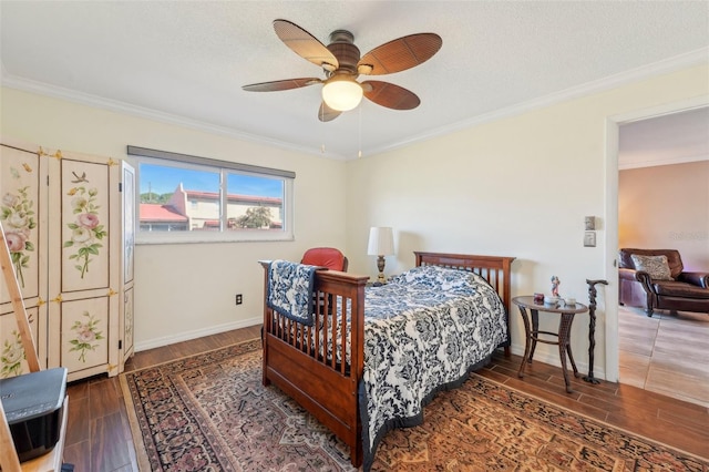 bedroom with crown molding, dark hardwood / wood-style floors, a textured ceiling, and ceiling fan