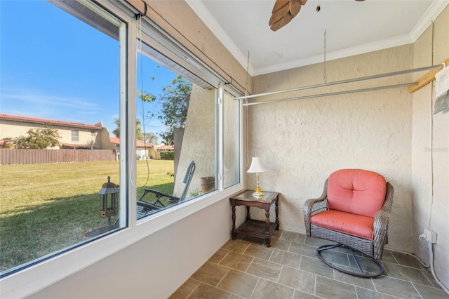 sunroom / solarium with ceiling fan