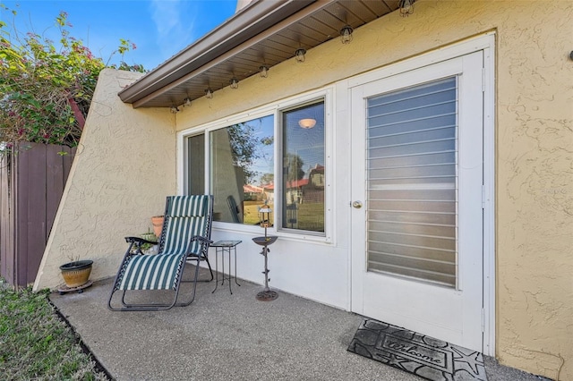 entrance to property featuring a patio area