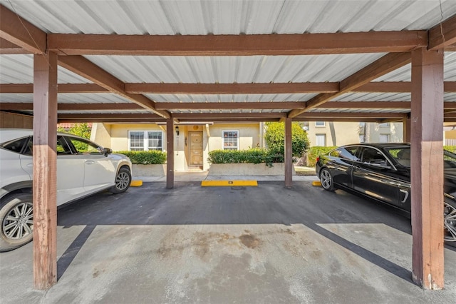 view of vehicle parking with a carport