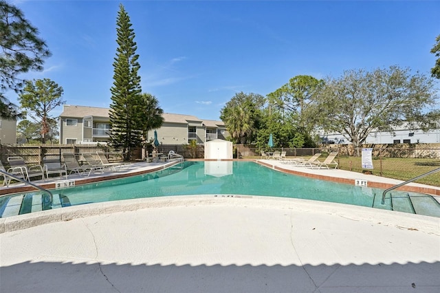 view of swimming pool with a patio