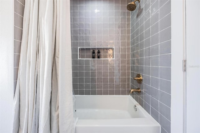 bathroom with shower / tub combo with curtain