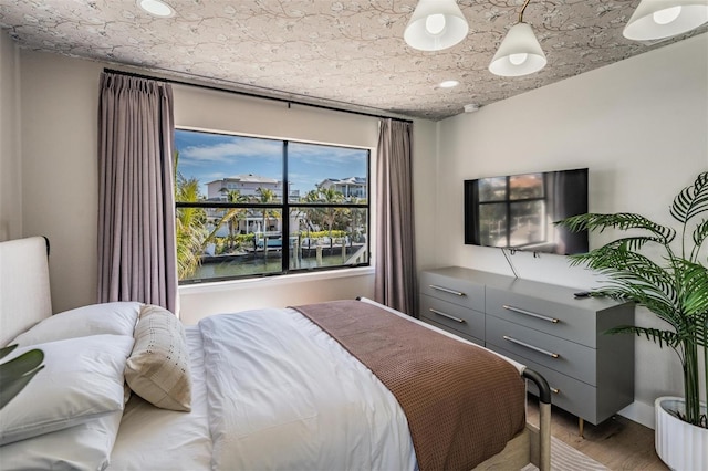 bedroom featuring hardwood / wood-style floors