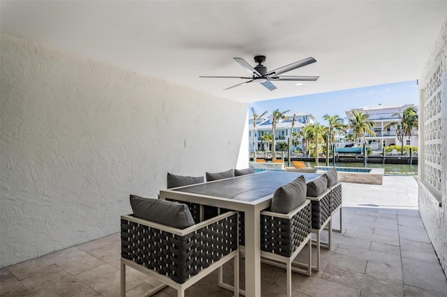 view of patio featuring a pool and ceiling fan