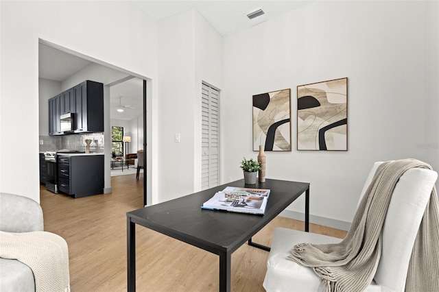 office area with ceiling fan and light wood-type flooring