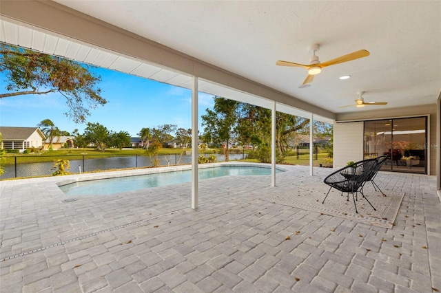 view of swimming pool featuring a water view