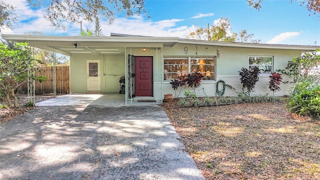 view of front of home featuring a carport