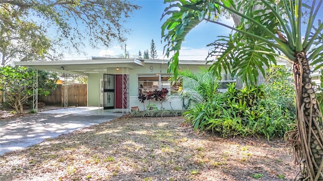 view of front of property with a carport