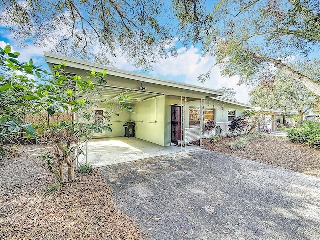 view of front of home featuring a carport