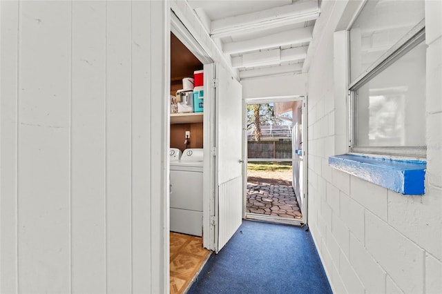 doorway to outside featuring independent washer and dryer and dark parquet floors