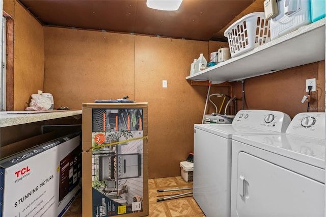 washroom featuring parquet flooring and independent washer and dryer