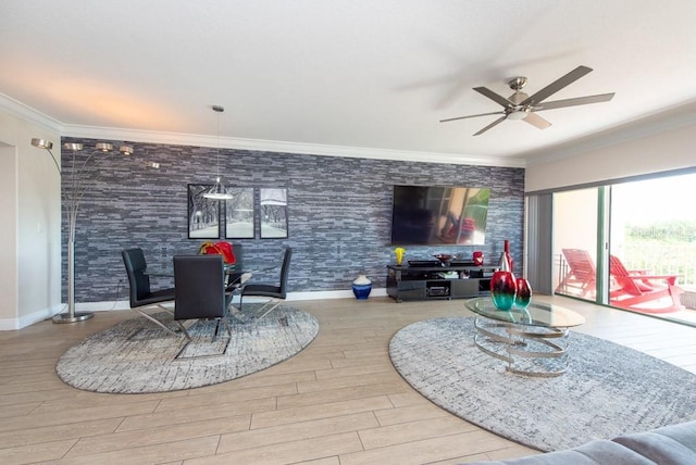 living room with crown molding, ceiling fan, and light wood-type flooring