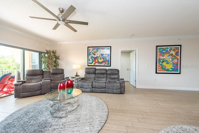 living room featuring ornamental molding, ceiling fan, and light wood-type flooring