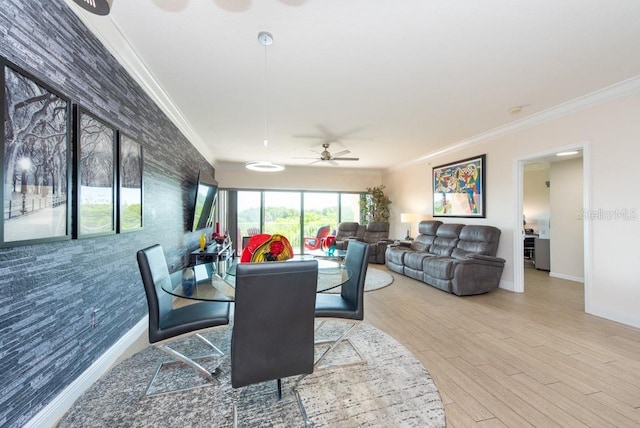 dining space with ornamental molding and wood-type flooring