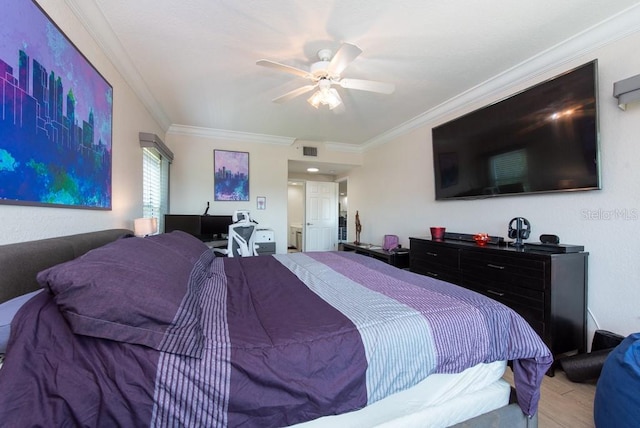 bedroom featuring crown molding, ceiling fan, and light wood-type flooring