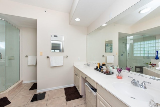 bathroom with tile patterned floors, an enclosed shower, and vanity