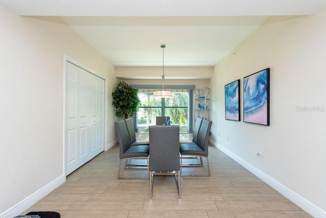 dining space with light hardwood / wood-style floors