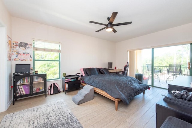 bedroom with light wood-type flooring, access to outside, and ceiling fan