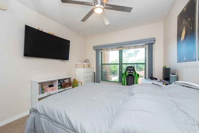 bedroom with hardwood / wood-style flooring and ceiling fan