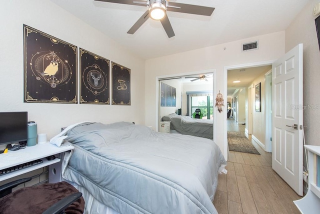 bedroom featuring a closet, ceiling fan, and light wood-type flooring