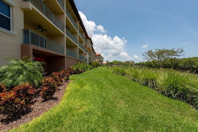 view of yard with ceiling fan