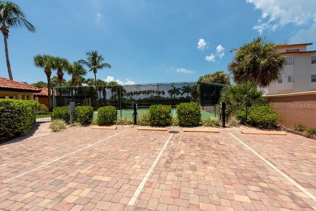 view of patio / terrace with tennis court