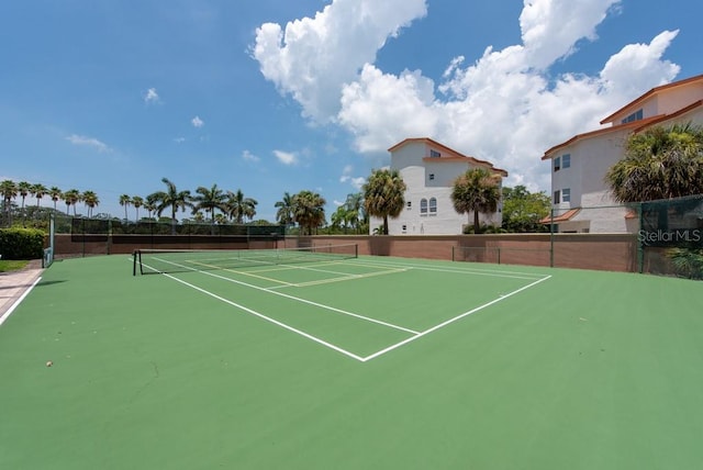 view of tennis court featuring basketball court