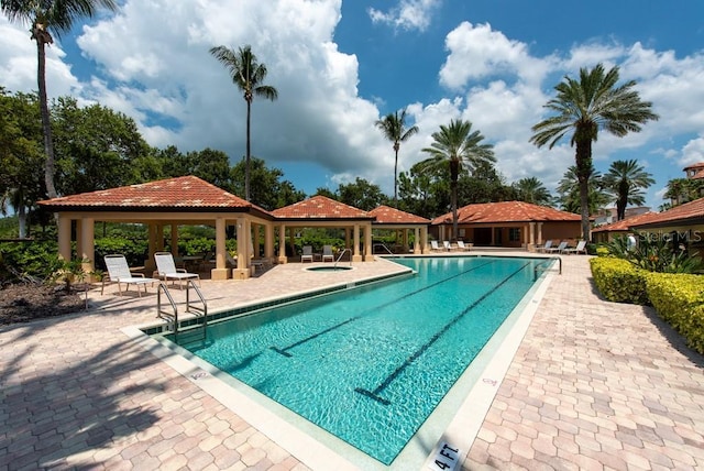 view of pool featuring a gazebo and a patio