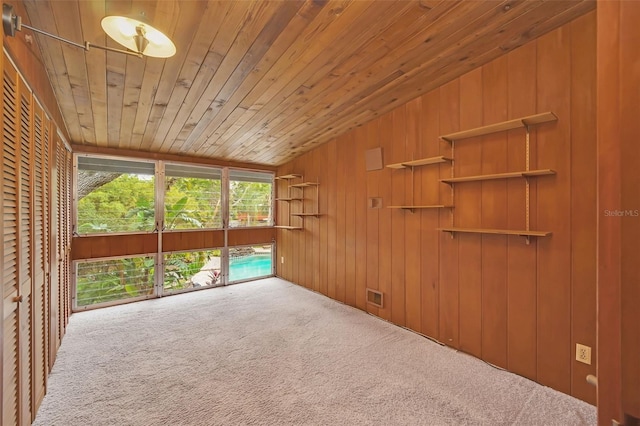 interior space featuring lofted ceiling and wood ceiling