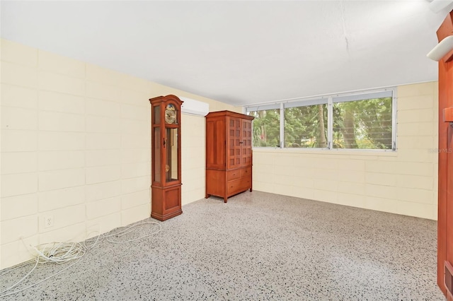 interior space featuring a wall mounted AC