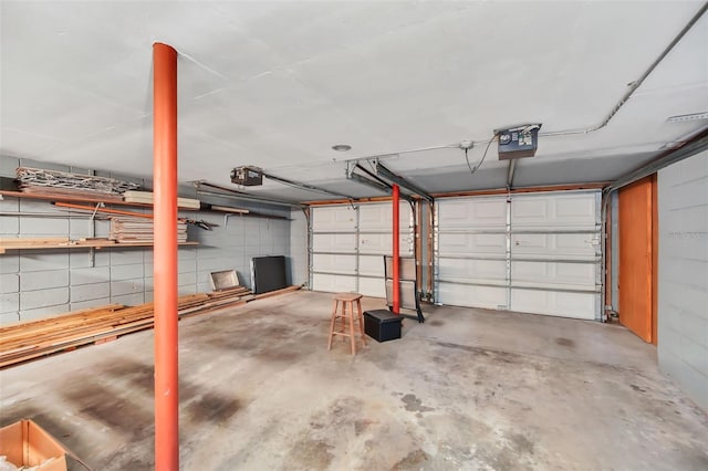 garage featuring a garage door opener