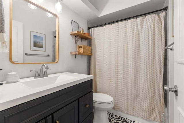 bathroom with walk in shower, vanity, and toilet