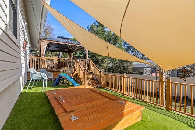 exterior space with a gazebo and a lawn