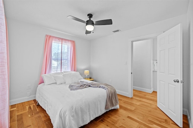 bedroom featuring hardwood / wood-style flooring and ceiling fan