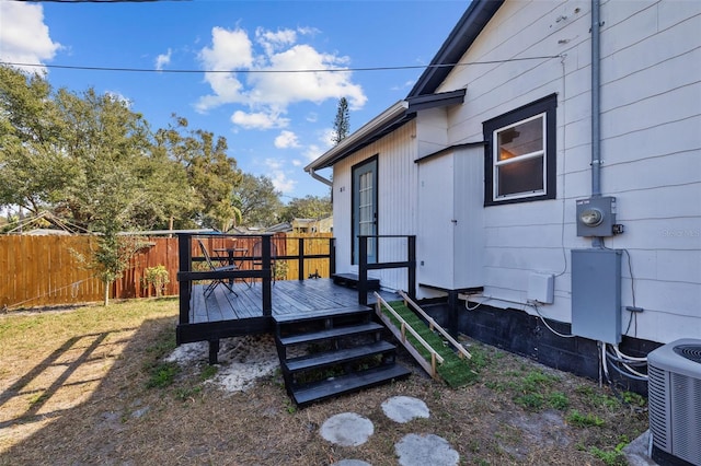 exterior space with a deck and central air condition unit