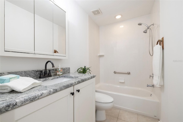 full bathroom with vanity, tile patterned floors, toilet, and washtub / shower combination