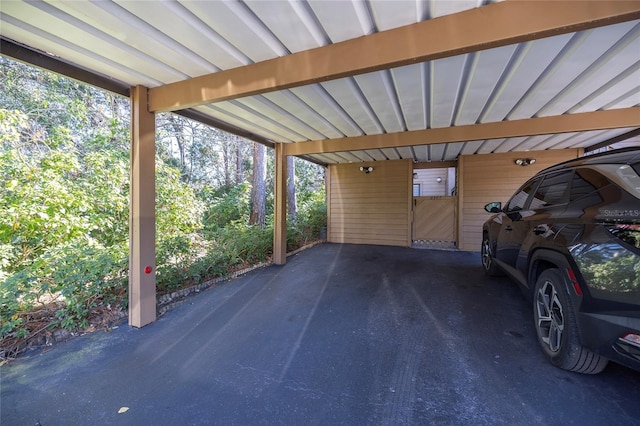 view of parking with a carport