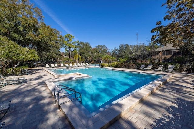 view of swimming pool with a patio