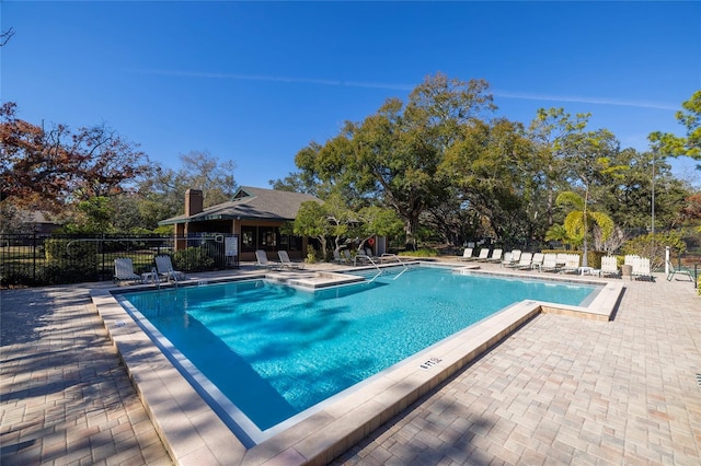 view of swimming pool featuring a patio area