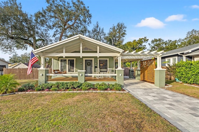 bungalow-style house with a porch and a front lawn