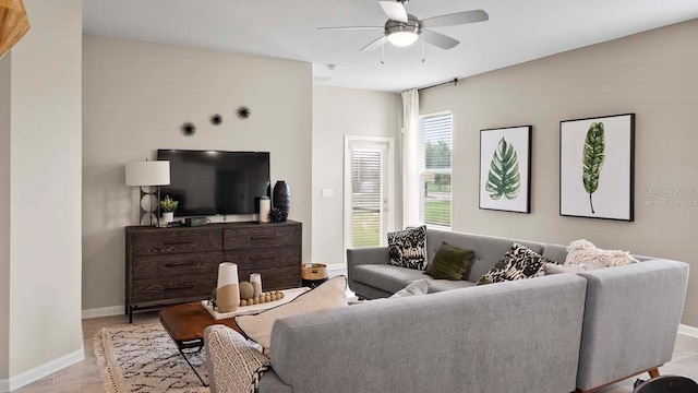 living room with ceiling fan and light hardwood / wood-style floors