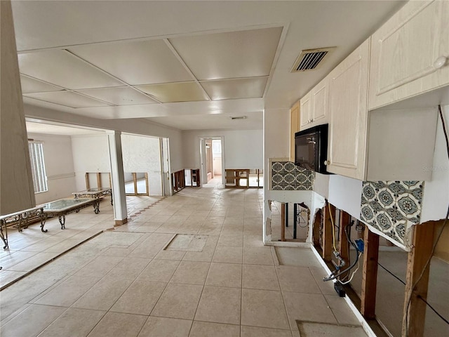 kitchen with light tile patterned flooring