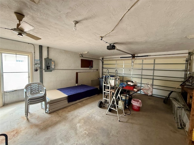 garage featuring a garage door opener and electric panel