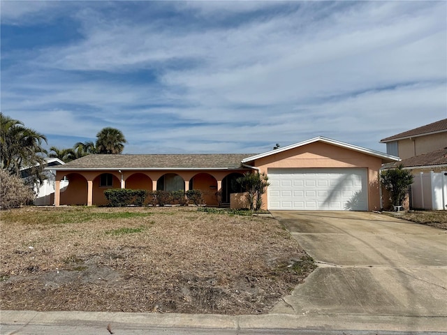 single story home featuring a garage