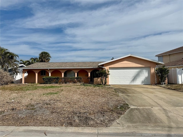 6437 1st Palm Pt, St Pete Beach, FL 33706 - ranch-style home with a garage, concrete driveway, a porch, and stucco siding
