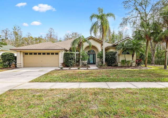 9116 Exposition Dr, Tampa, FL 33626 - view of front of house featuring a garage and a front lawn